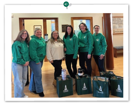 IFS employees from Storey Ave., Newburyport with a representative from Santa's Helpers program, November 2024