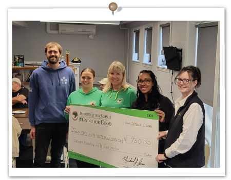 Employees from the Gloucester office present a check to a representative from Cape Ann Veterans Services, October 2024